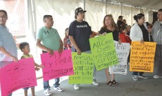 Protestors opposing the Cree School Board's new bus contract at the Annual General Assembly in August 2014